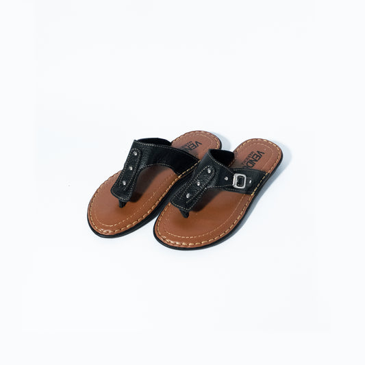Pair of black and brown sandals on a white background