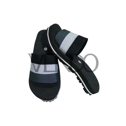 Black and gray striped sandals on a white background