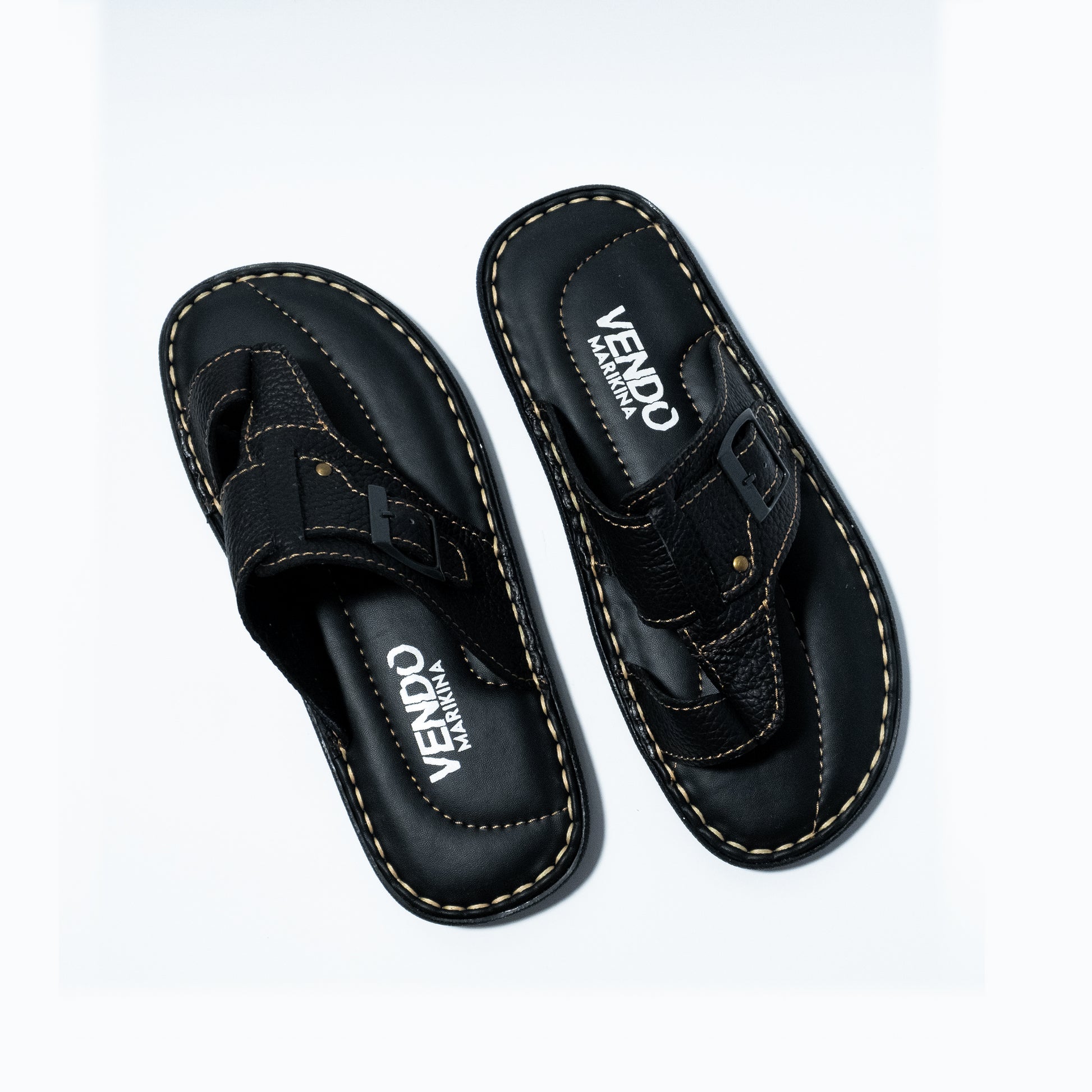 Pair of black sandals with 'VENDO' branding on a white background