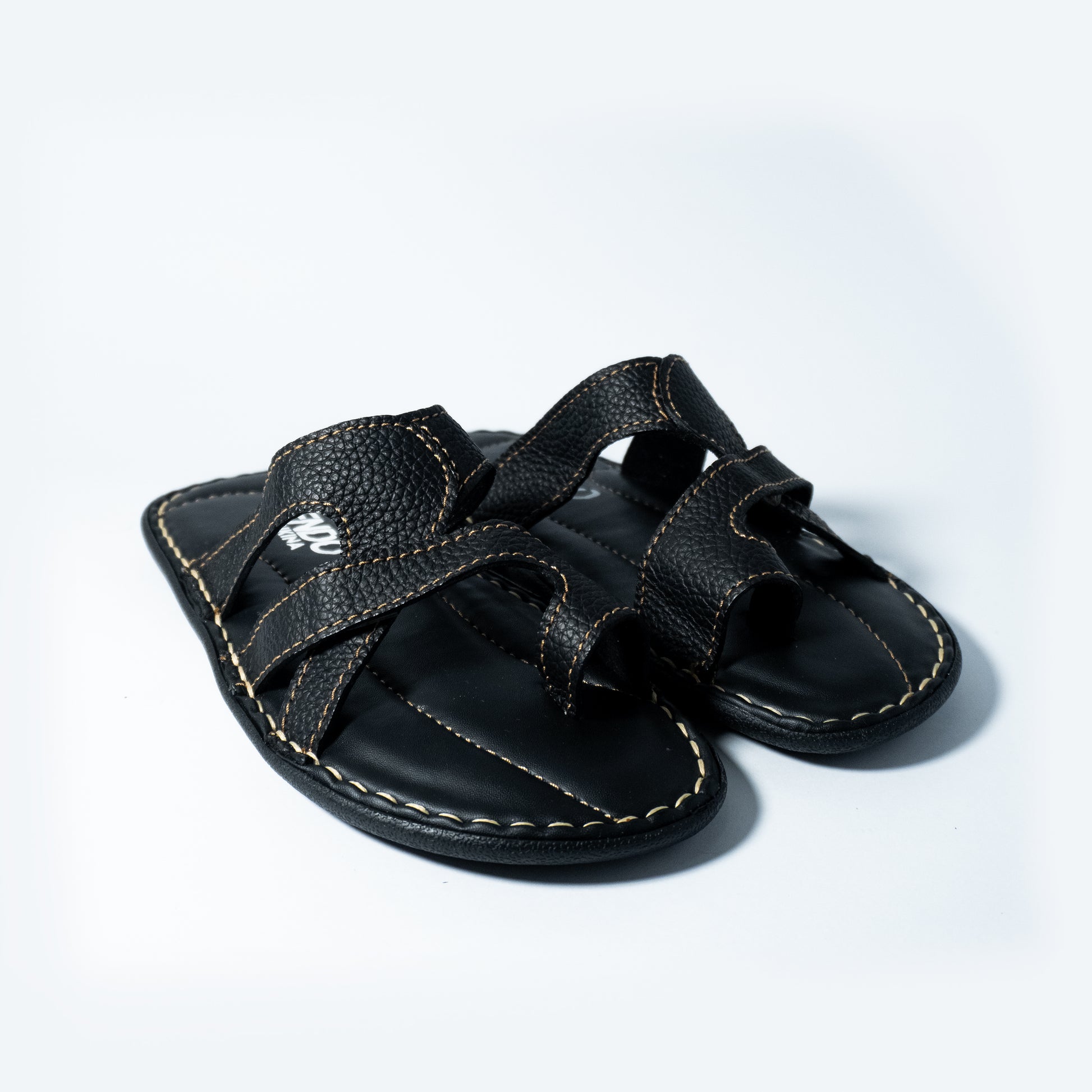 Black sandal on a light gray background