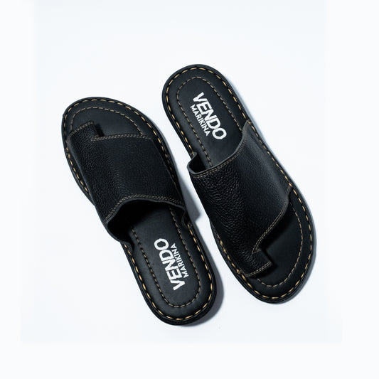 Black sandals with 'VENDO' branding on a white background