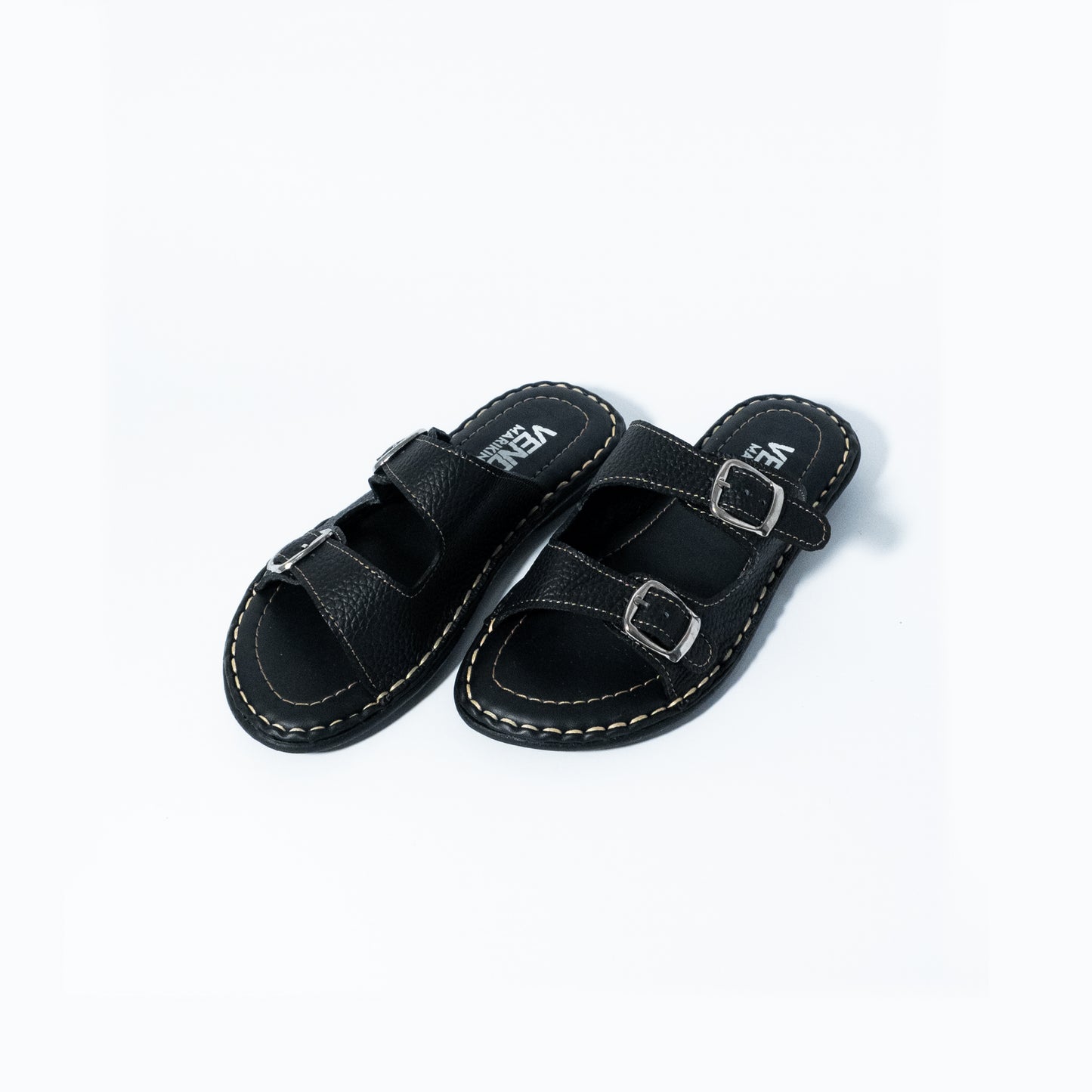 Black sandals with buckle straps on a white background