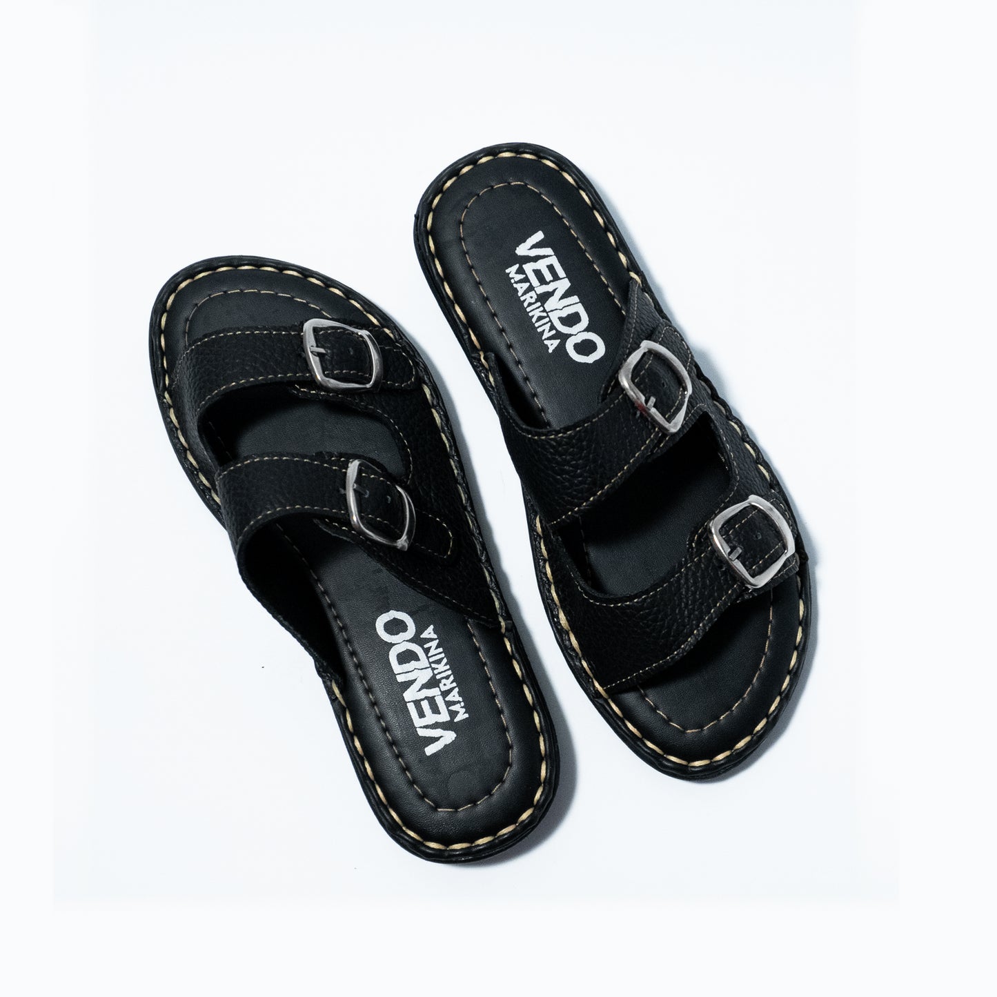 Black sandals with 'VENDO' branding on a white background