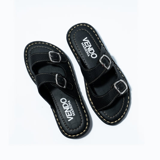 Black sandals with 'VENDO' branding on a white background