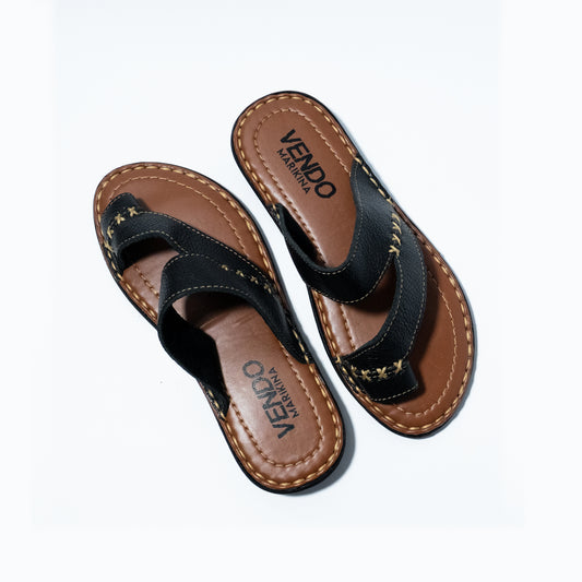 Pair of black and brown sandals with 'VENDO' branding on a white background