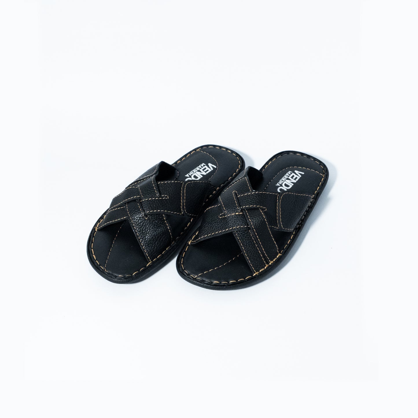 Pair of black sandals with 'VENDO' branding on a white background