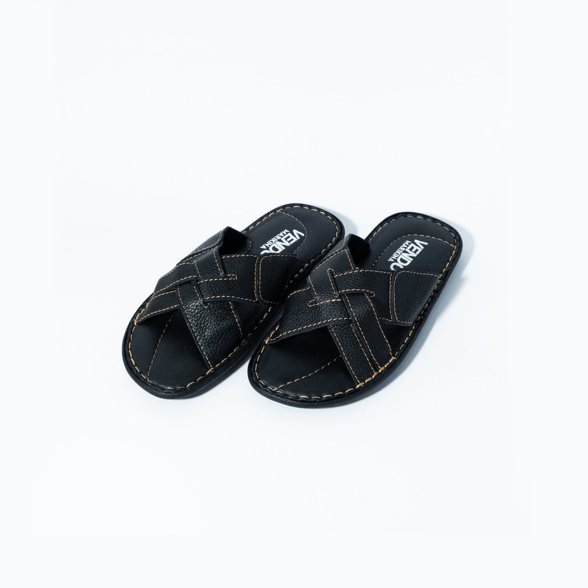Pair of black sandals with 'VENDO' branding on a white background