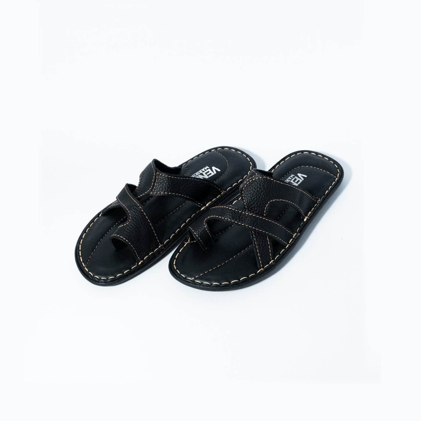 Pair of black sandals on a white background