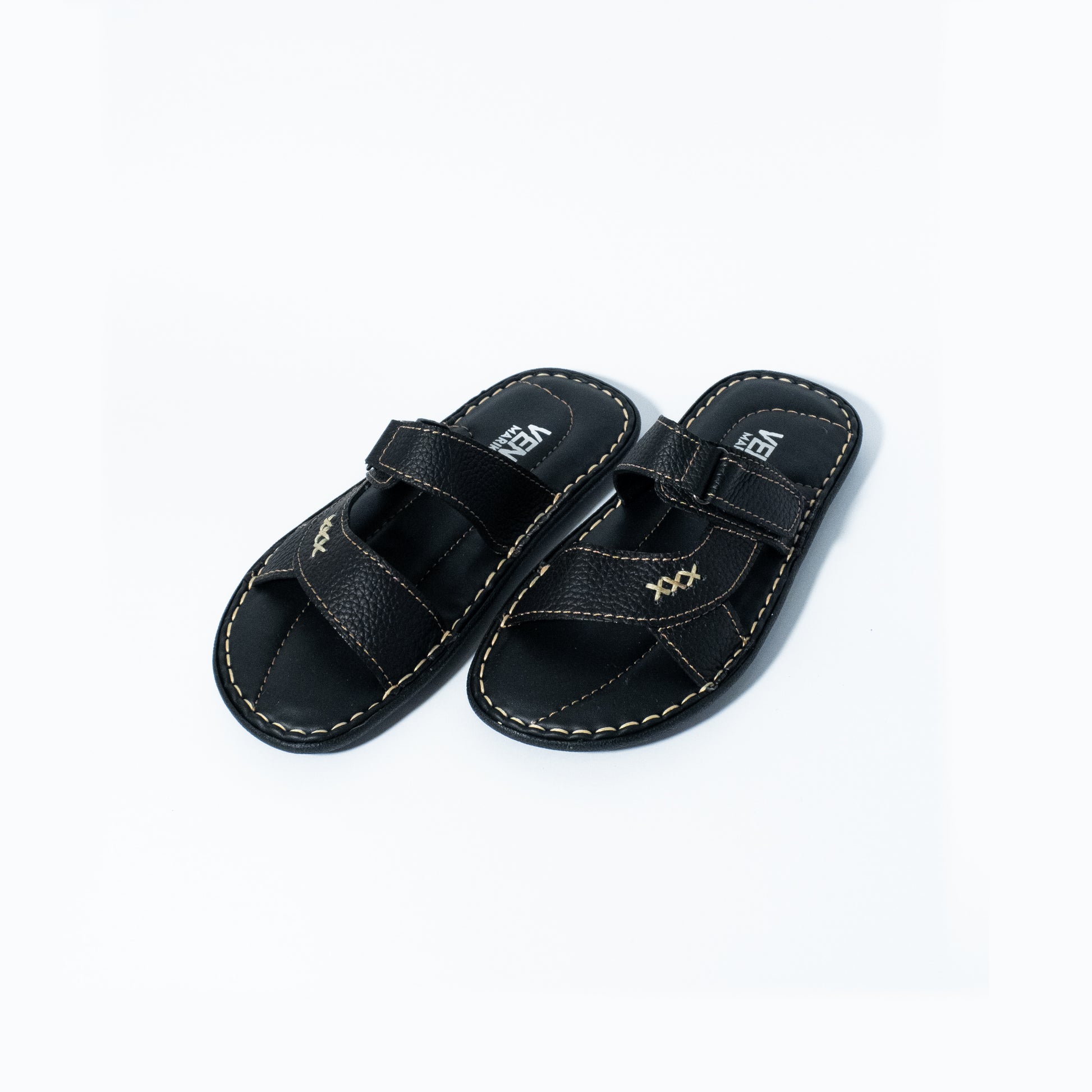 Pair of black sandals with a strap on a white background