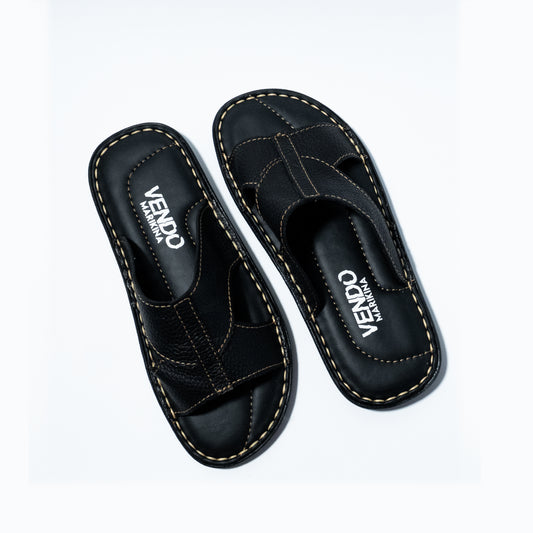 Pair of black sandals with 'VENDO' branding on a white background