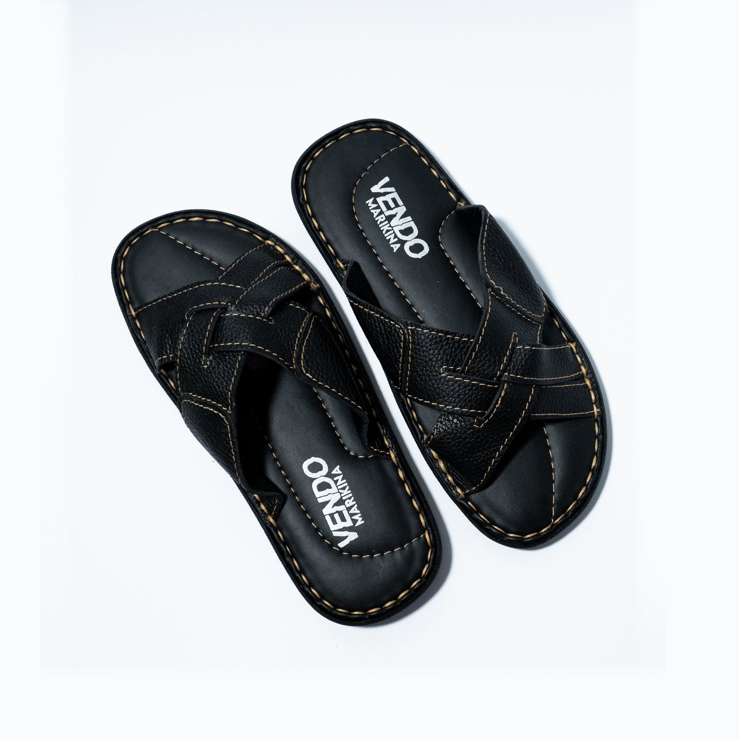 Black sandals with 'VENDO' branding on a white background