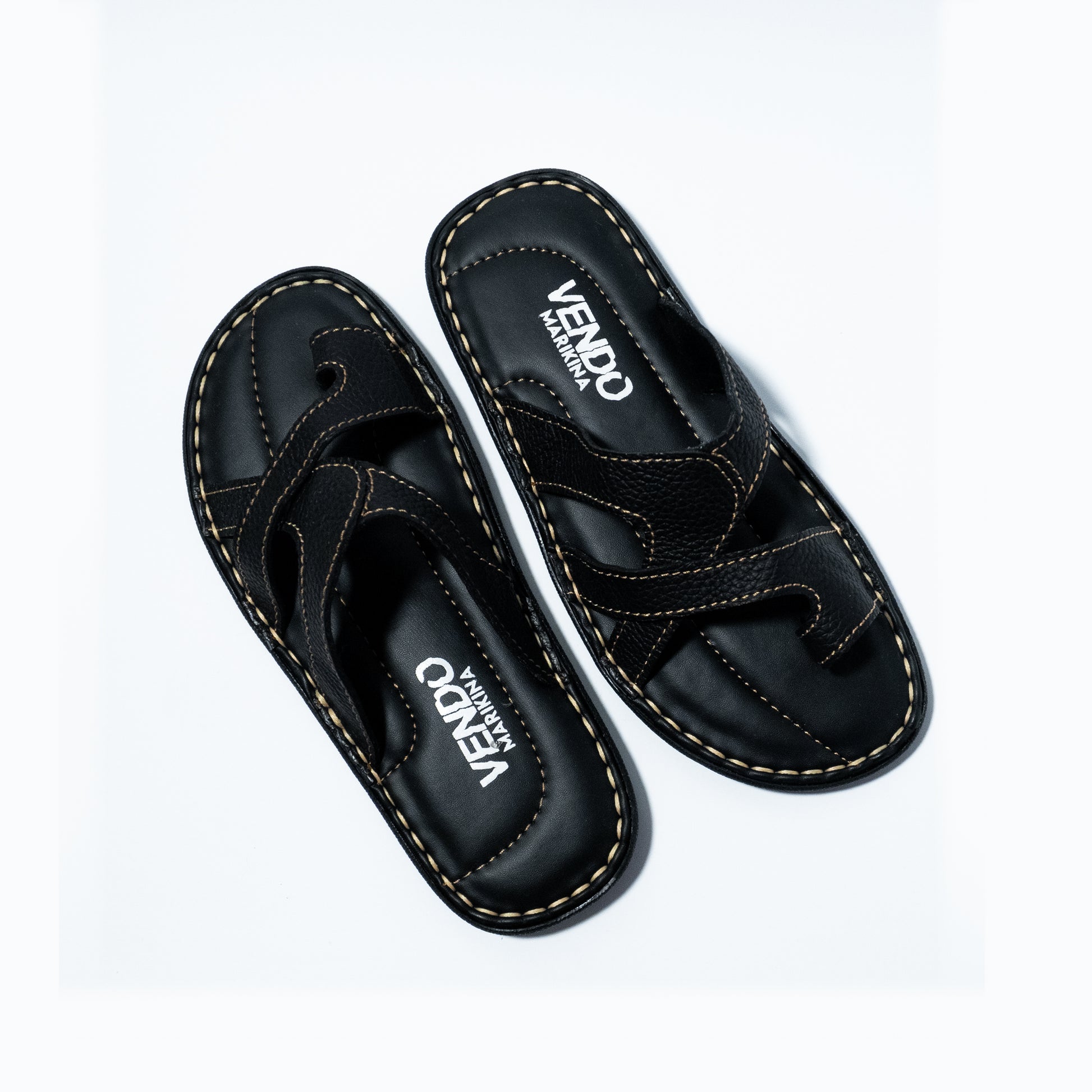 Black sandals with 'VENDO' branding on a white background