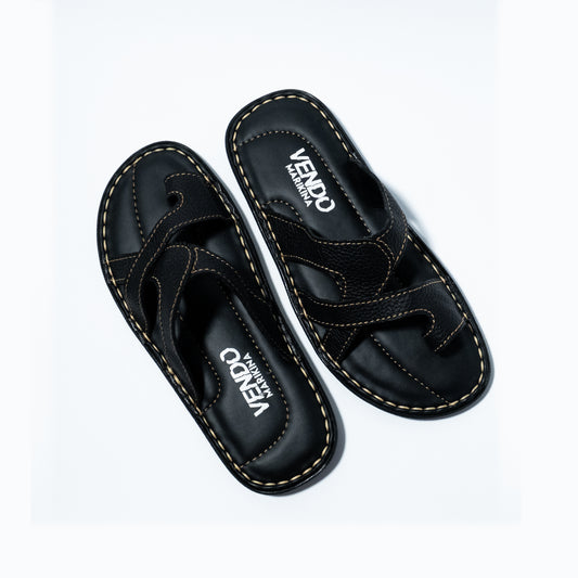 Black sandals with 'VENDO' branding on a white background