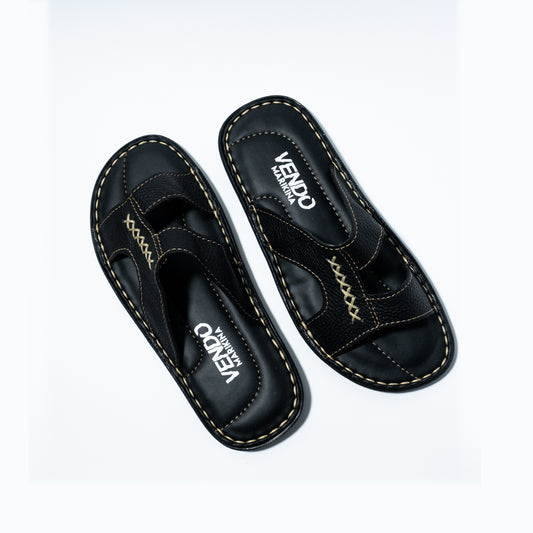 Pair of black sandals with visible branding on a white background