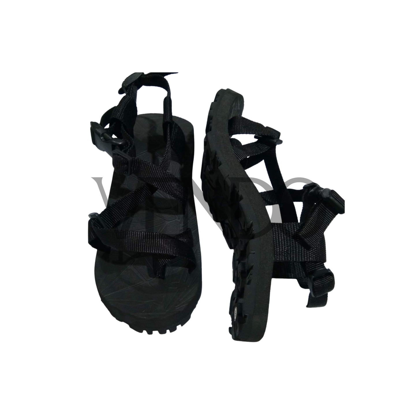 Pair of black sandals with strap details on a white background