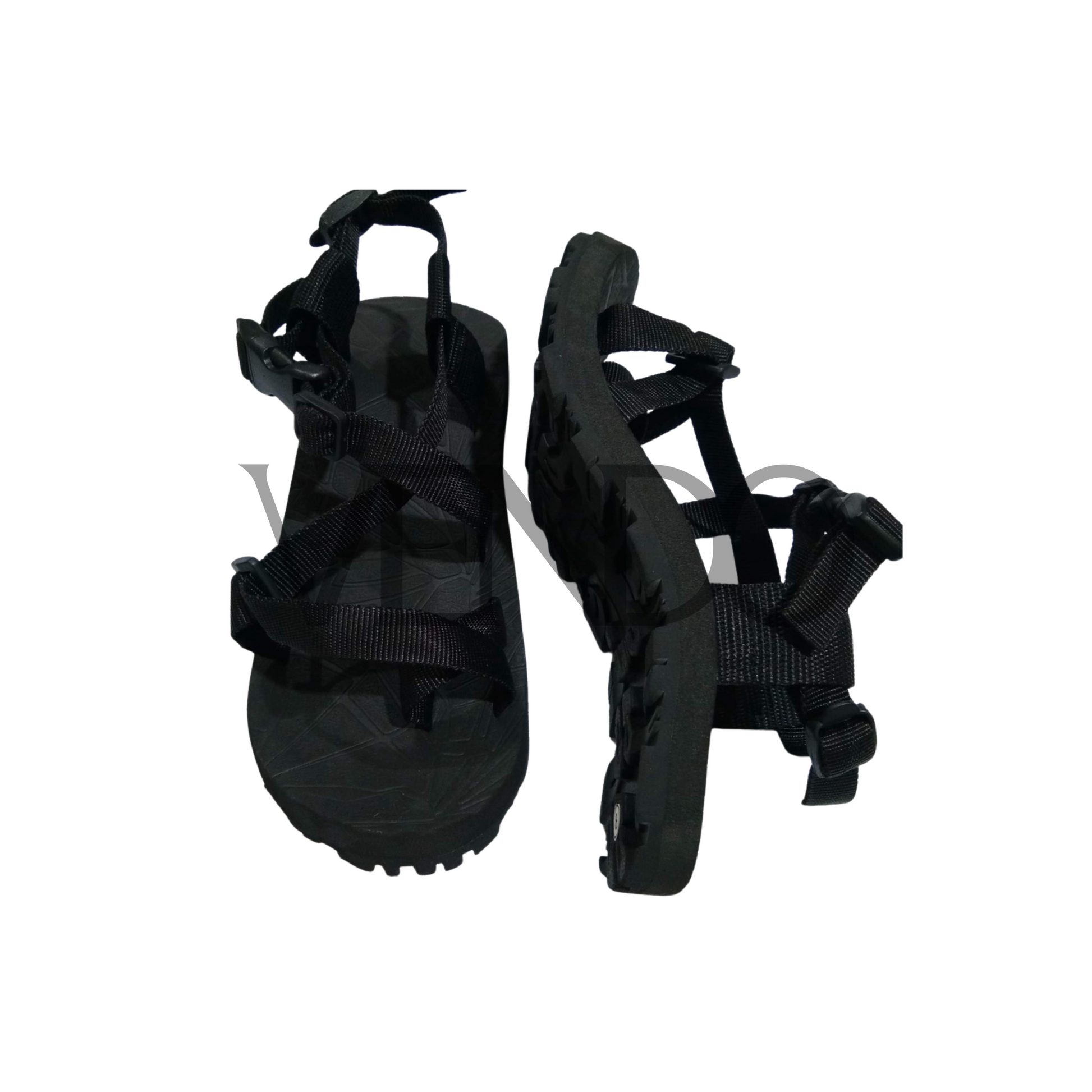 Pair of black sandals with strap details on a white background