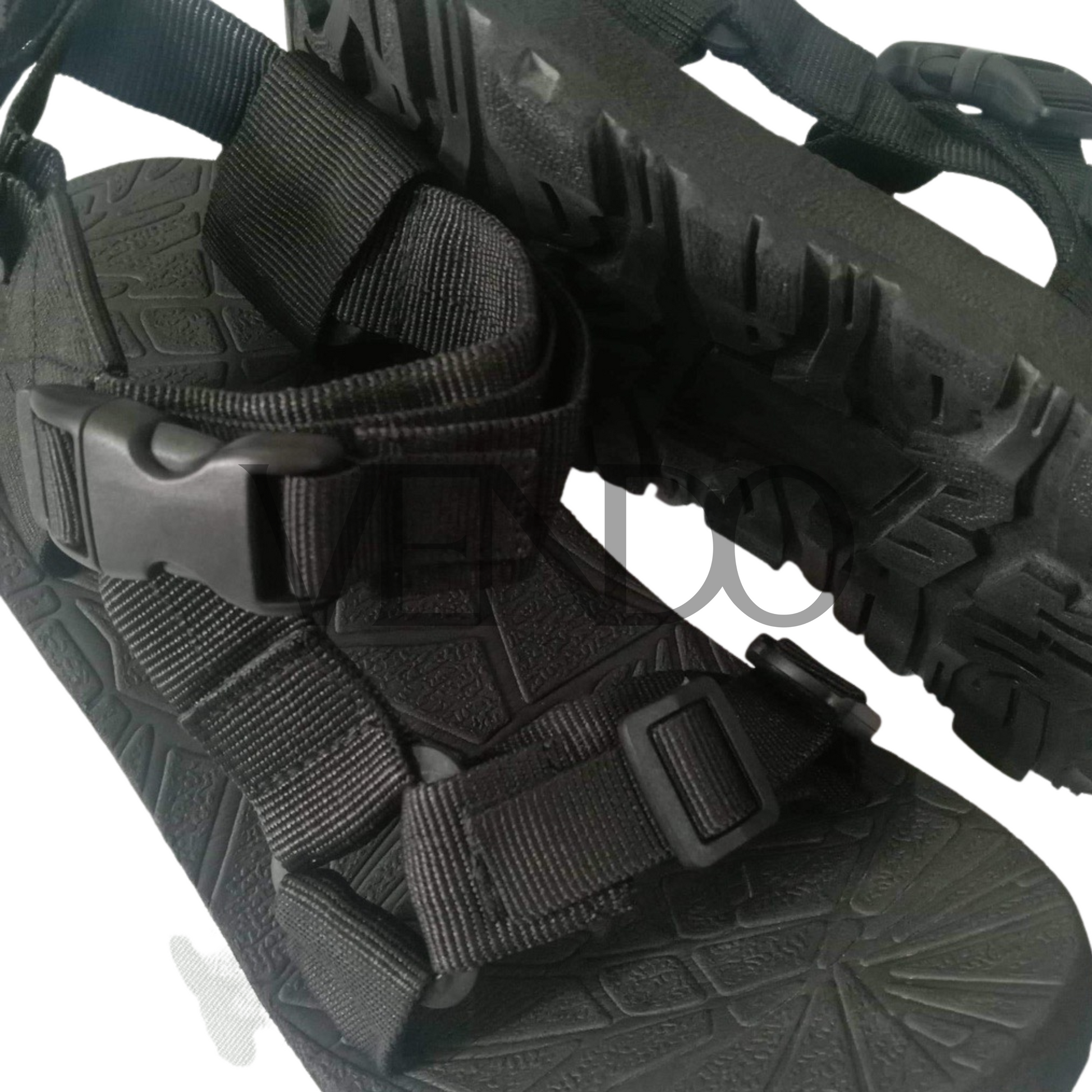 Black sandal with straps on a white background