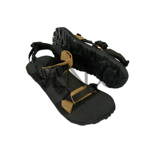 Black and brown sandal with straps on a white background